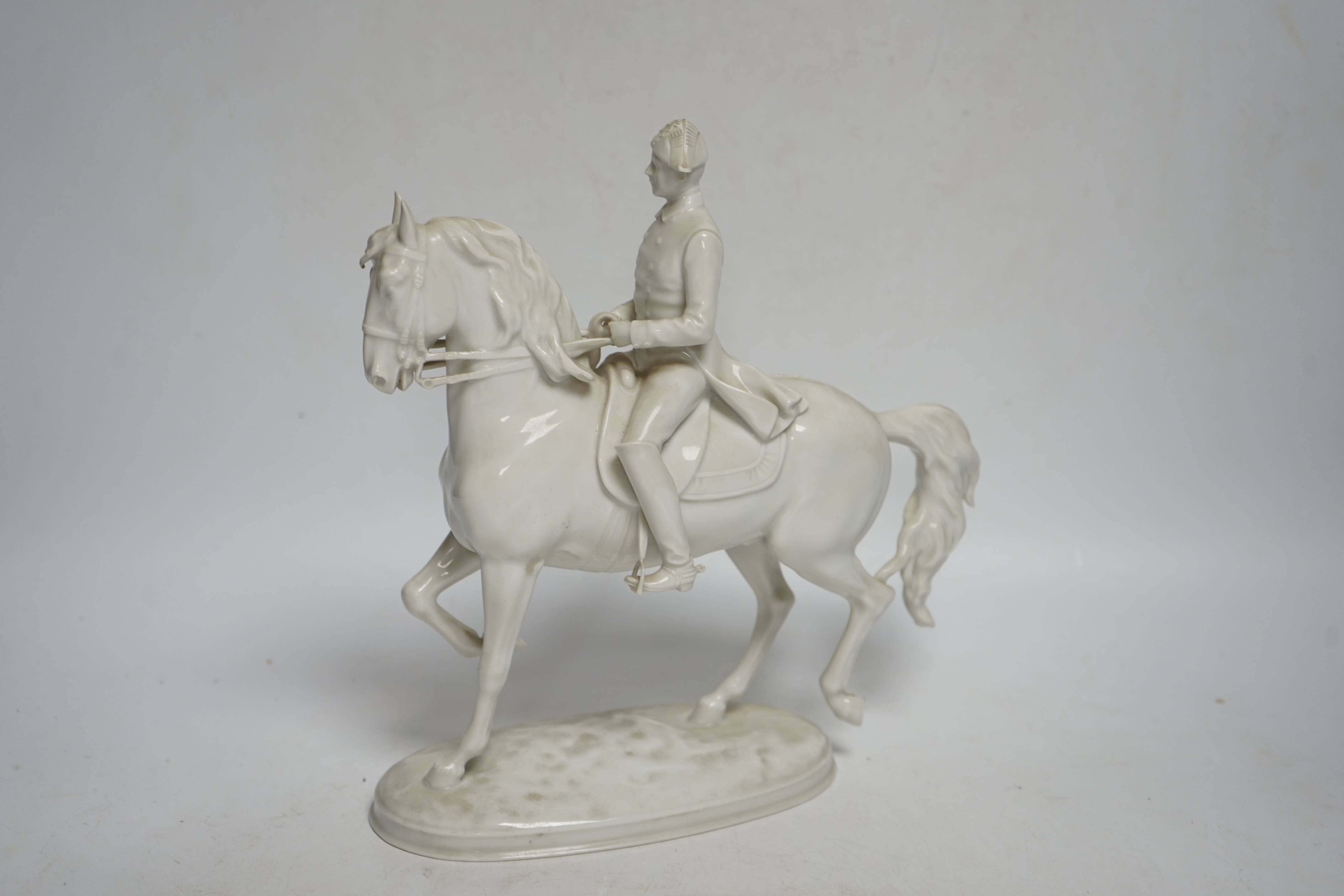 An Augarten, Wien white glazed porcelain Spanish Riding School Group, 24cm